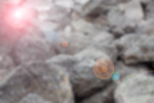 Stone blurred lens flare background.