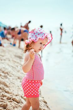 Cute little girl playing on the beach