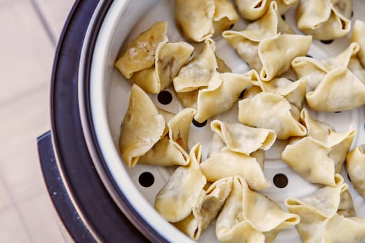 Cooking pasta, ravioli, gedza in a steamer