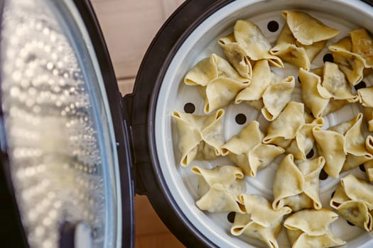 Cooking pasta, ravioli, gedza in a steamer