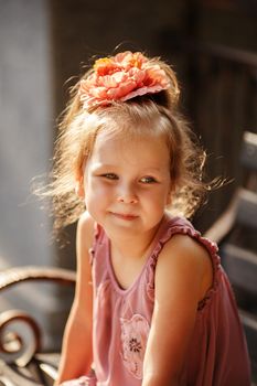 Close-up portrait of a lovely urban little girl outdoors