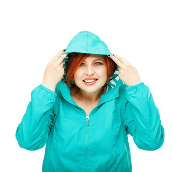 Portrait of a young beautiful girl in a jacket with a hood isolated on white background. Change of summer clothes for autumn. Change of winter clothing for spring. Weather forecast, metcast