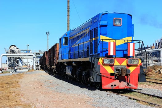 Blue Diesel Locomotive On unloading sugar beet factory for the production of sugar