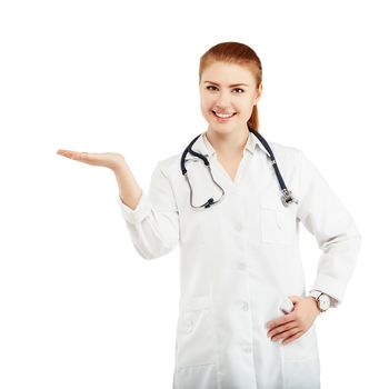 Portrait of a young female doctor in a white coat holding in hands anything against a white background. Doctor holding anything isolated on white background. Medicine for cold