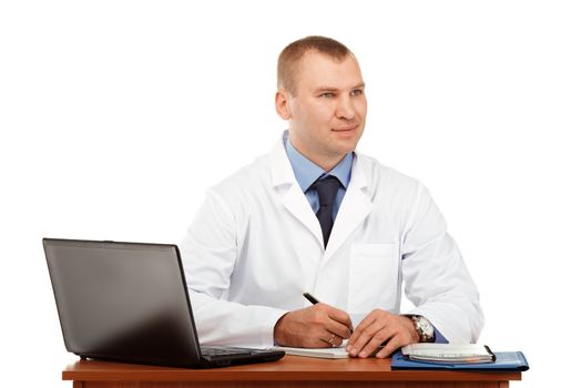 Portrait of a young male doctor in a white coat against a white background