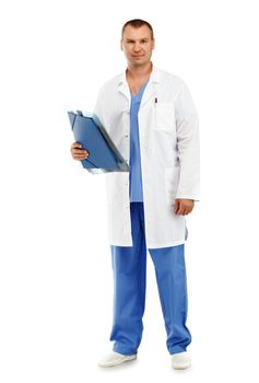 Full-length Portrait of a young male doctor in a white coat and blue scrubs against a white background