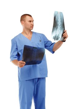 Portrait of a young male doctor in a medical surgical blue uniform against a white background