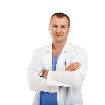 Portrait of a young male doctor in a white coat and blue scrubs against a white background