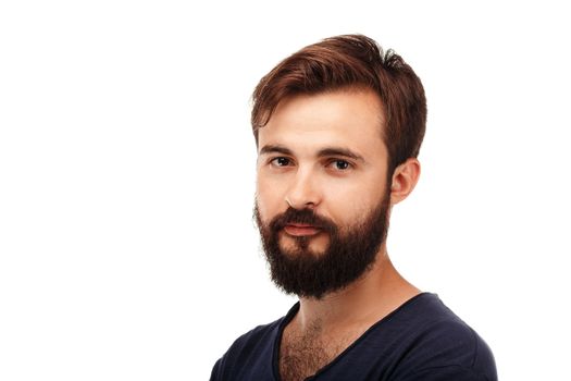 Close-up Portrait of a young bearded man isolated on white background