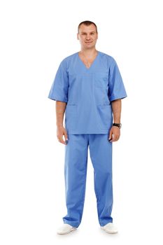 Full length portrait of a young male doctor in a medical surgical blue uniform against a white background