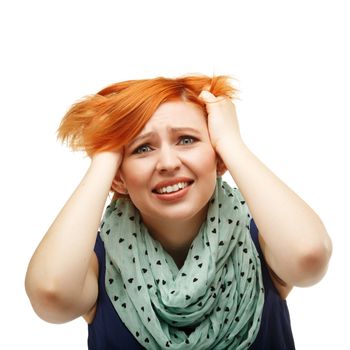 Close-up portrait of a funny red-haired girl emotionally gesticulating and waving his hands isolated on white background. Portrait of the girl tearing their hair. Mimicry