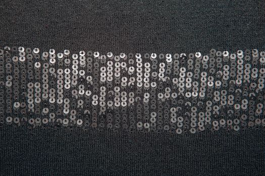 Black knitted fabrics texture with sequins