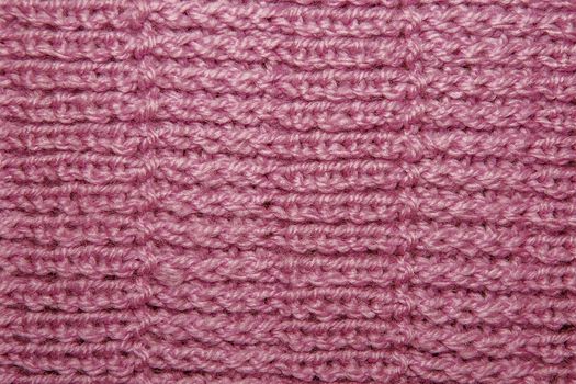 Wool hand-knitted Pattern. Closeup Fabric Background