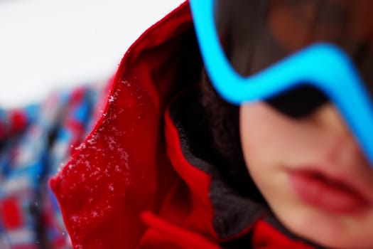 Portrait of little boy with ski outfit, blured