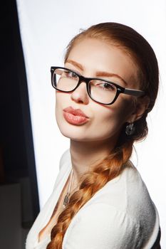 Portrait of a business intern woman with glasses smiling and happy