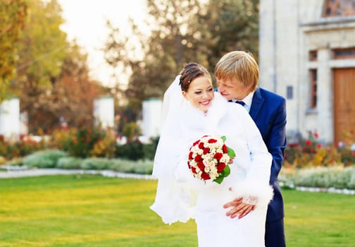 Photo of happy newlyweds. Beautiful young bride and groom in love. Wedding concept