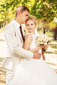Beautiful young bride and groom in love. Wedding concept