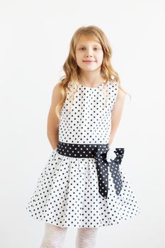 Portrait of a lovely little girl against a white background