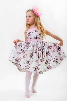 little girl dancing on a white background