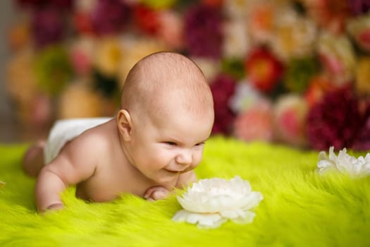 little baby lying down and smiling