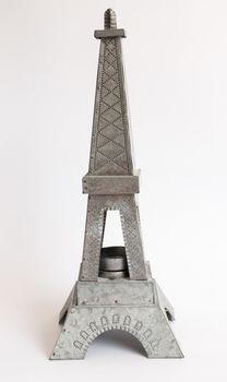 Model Eiffel Tower zinc white background.