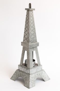 Model Eiffel Tower zinc white background.