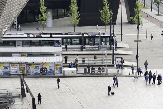 ROTTERDAM,HOLLAND-MAY 18, trams are waiting for people to enter in front of central station rotterdam on May 18 2016 in Rotterrdam, this station is opened in end 2015