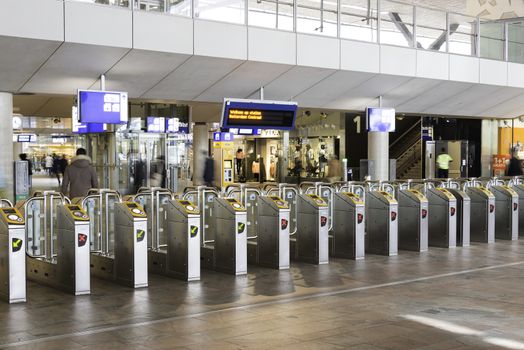 ROTTERDAM,HOLLAND-MAY 18, row of tourniquets to enter rotterdam central station in Holland on May 18 2016 in Rotterrdam, this station is opened in end 2015