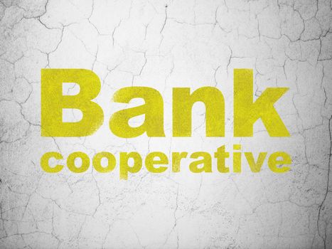 Currency concept: Yellow Bank Cooperative on textured concrete wall background