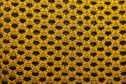 texture of knitted fabric, openwork knit, knitted fabrics of cotton yarn as background.