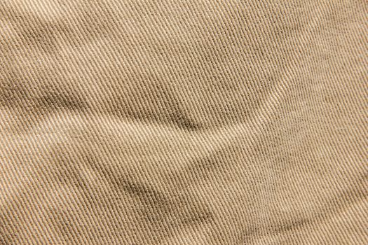 Velvet texture background fabric, denim cotton, Brown jeans texture, beige velvet Denim fabric texture background close-up vertical direction flows