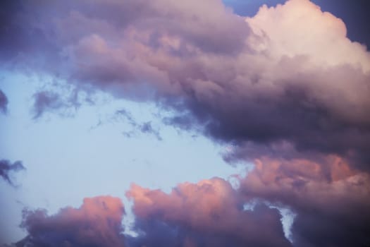 colorful dramatic sky with clouds at sunset for background and texture