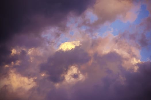 colorful dramatic sky with clouds at sunset for background and texture