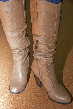 women's boots on his feet brown, women's shoes, heels, Soft focus