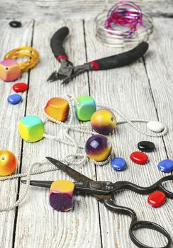 chain,pair of scissors and set of beads for jewelry
