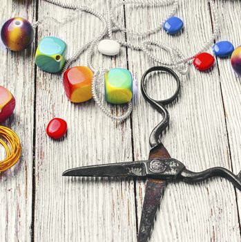 chain,pair of scissors and set of beads for jewelry