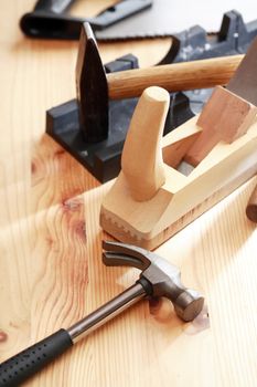 Set of carpenter tools on wooden workbench