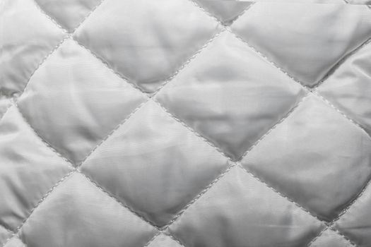quilted fabric texture of white color for hammering, backgrounds and textures