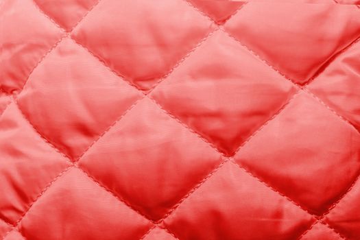 quilted fabric texture of red color for hammering, backgrounds and textures