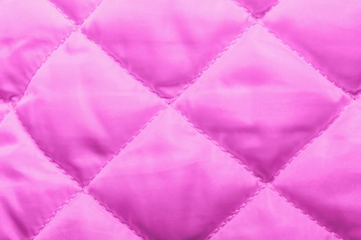 quilted fabric texture of pinkl color for hammering, backgrounds and textures