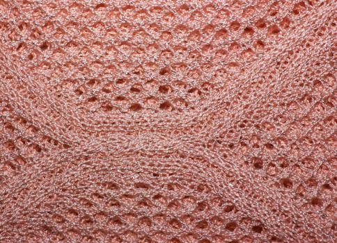 Pink knitted wool fabric texture closeup. with lurex thread, Jersey Knitted background with a relief pattern