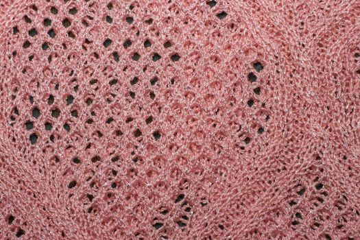 Pink knitted wool fabric texture closeup. with lurex thread, Jersey Knitted background with a relief pattern