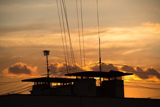 Natural background of  colorful red sky during  sunset time with street roofs.