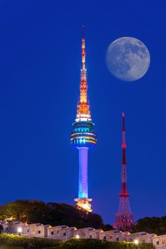 N Seoul Tower with full moon Located on Namsan Mountain in central Seoul,South Korea.