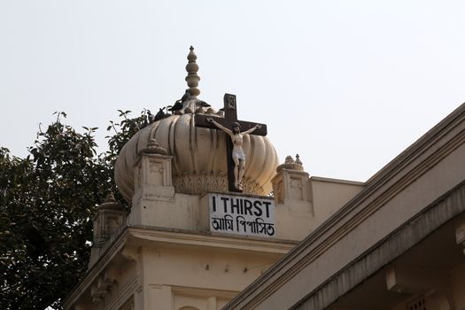 Crucifix on top of the Nirmal Hriday, Home for the Sick and Dying Destitutes, one of the buildings established by the Mother Teresa and run by the Missionaries of Charity in Kolkata, India on February 10, 2014.