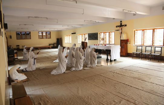 Sisters of Mother Teresa's Missionaries of Charity in prayer in the chapel of the Mother House, Kolkata, India at February 08, 2014.