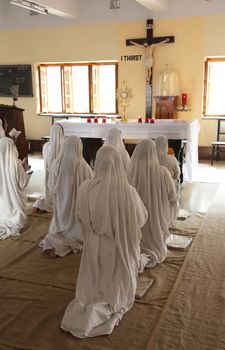 Sisters of Mother Teresa's Missionaries of Charity in prayer in the chapel of the Mother House, Kolkata, India at February 08, 2014.