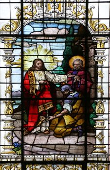 Jesus and the centurion. Lord, I am not worthy to have you come under my roof..., stained glass window in the Basilica of the Sacred Heart of Jesus in Zagreb, Croatia on December 27, 2013