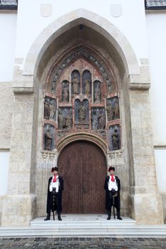 Guard of Honor of the Cravat Regiment on the south portal of the church of St. Mark in Zagreb, Croatia on September 20, 2014