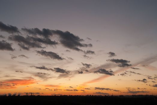 Natural background of  colorful red sky during  sunset time with street roofs.